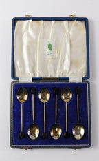 A cased set of six silver and enamel coffee bean spoons