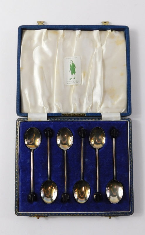 A cased set of six silver and enamel coffee bean spoons