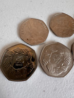 Lot 35: Rare 50ps x 9 (Estimate £10-20)