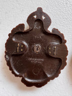 Lot 43: A rare Second World War period King's Own Malta Regiment economy plastic cap badge + other (Estimate £100-200)