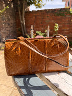 Lot 18: vintage crocodile handbag (Estimate £10-20)