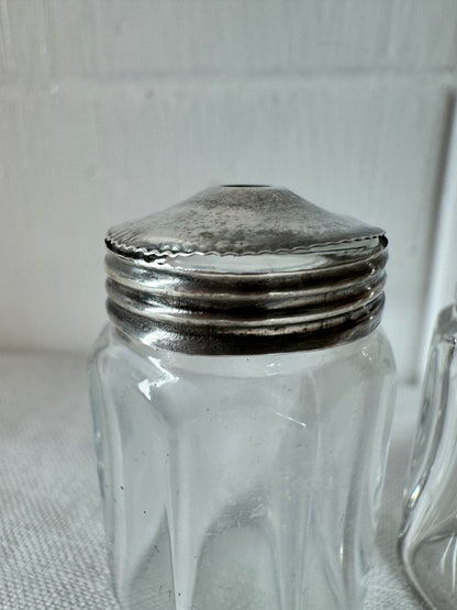 Pair of antique/vintage sterling silver topped salt and pepper pots with faceted glass