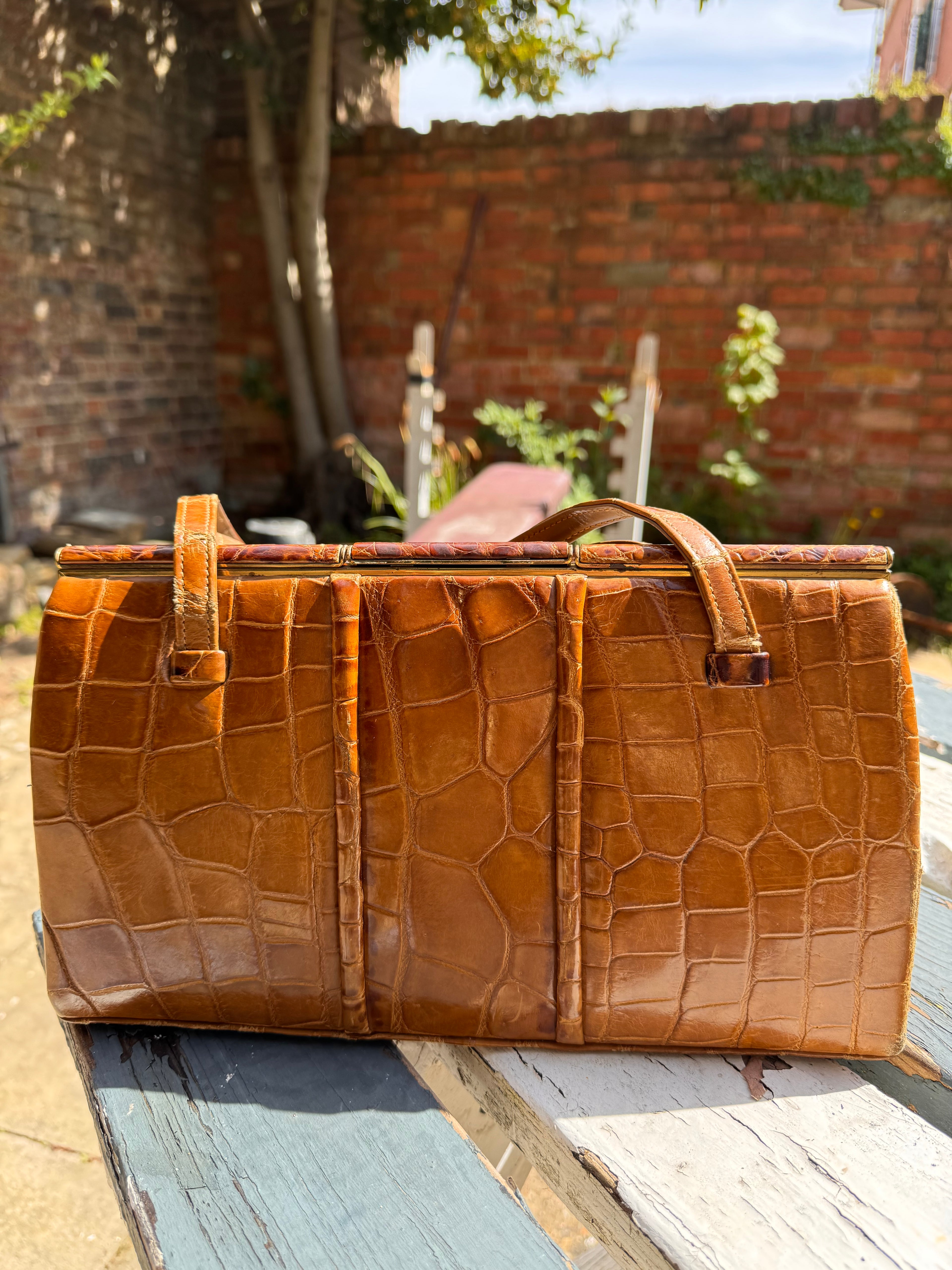 Lot 18: vintage crocodile handbag (Estimate £10-20)