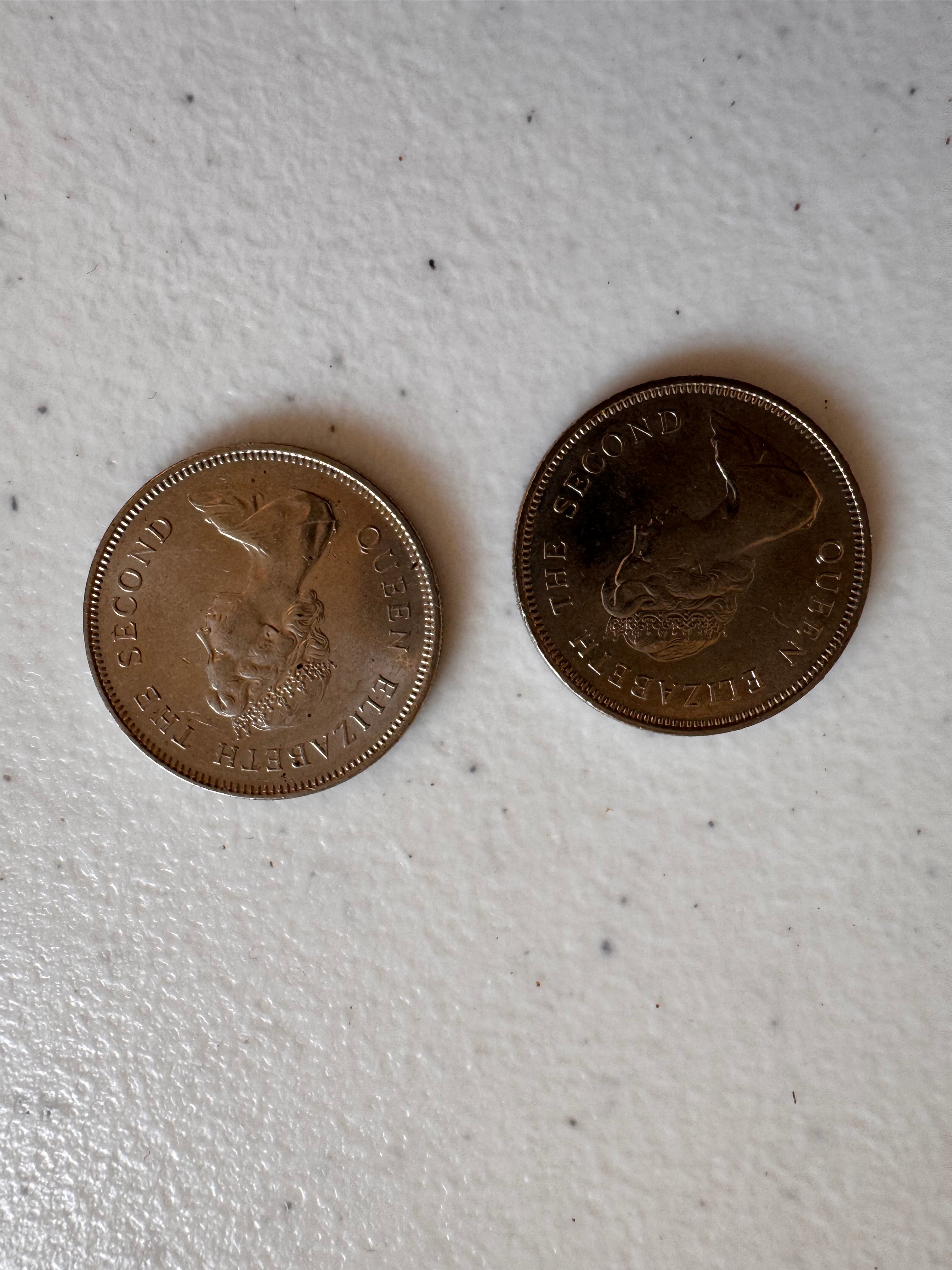 Lot 56: Two Hong Kong dollar coins  (Estimate £5)