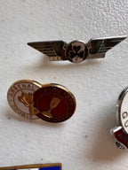 Lot 45: A collection of Arsenal badges + more (estimate £20)